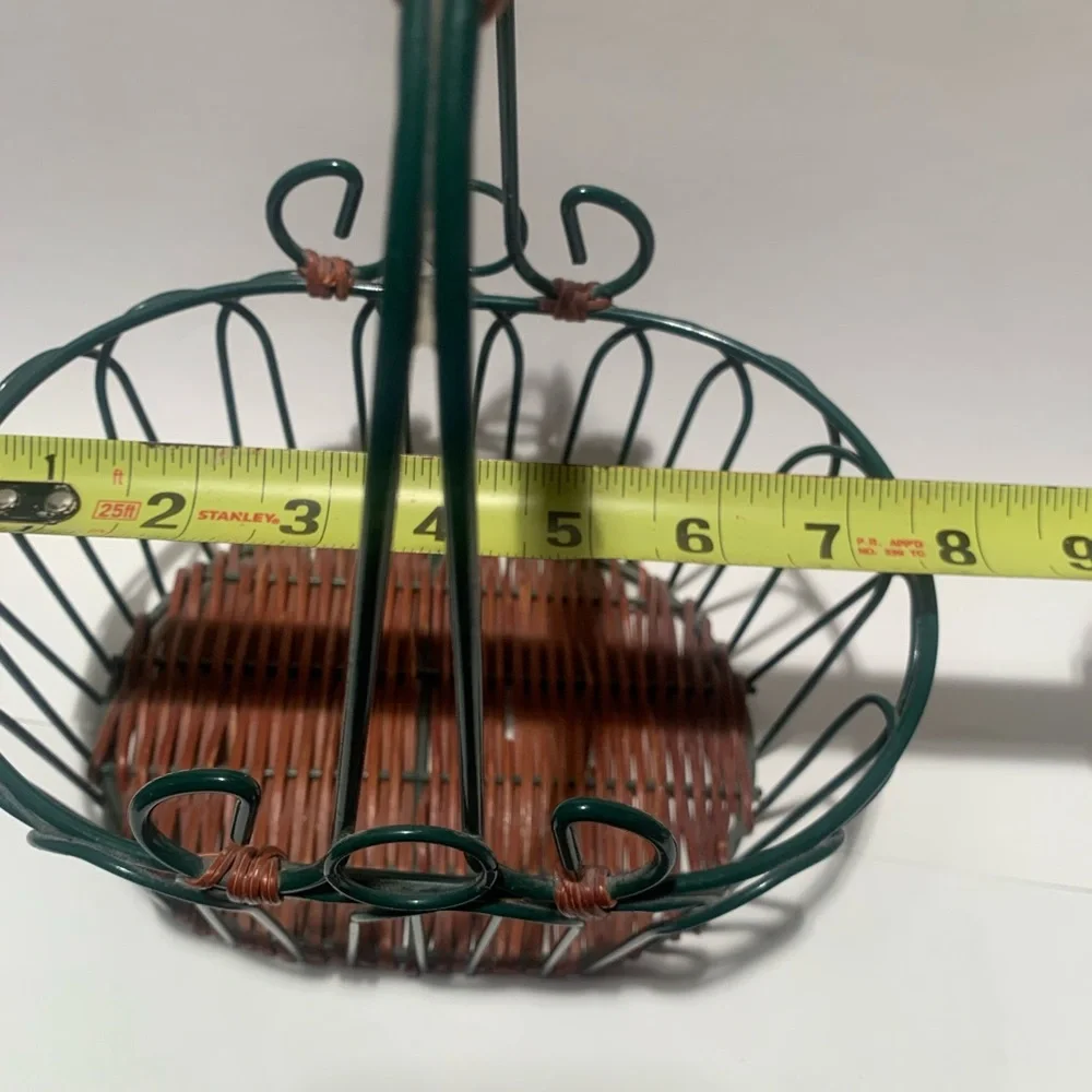 Green wire basket with brown woven bottom